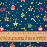 Cotton poplin printed gingerbread men and glittered stars blue background