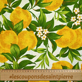 Polycoton imprimé citrons et feuilles vertes fond blanc