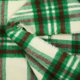 Brushed polyester wool with green and brown checks on an ecru background