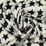 Black stars polyester satin broken white background