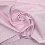 Piqué de coton imprimé cœur fond rose clair