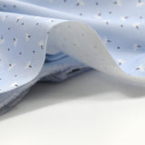Piqué de coton imprimé pissenlit fond bleu clair