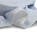 Piqué de coton imprimé cœur fond bleu clair
