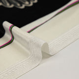 Jersey corto de terciopelo con raya ornamental y estampado de lunares marfil, fondo negro