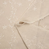 Voile de polyester brodé fleurs et feuillages beige