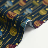Cotton poplin printed with vintage Christmas baubles on a midnight blue background