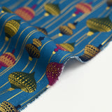 Cotton poplin printed with vintage Christmas baubles on a duck background