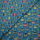 Cotton poplin printed with vintage Christmas baubles on a duck background
