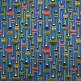 Cotton poplin printed with vintage Christmas baubles on a duck background