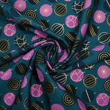 Cotton poplin printed with festive balls and golden flashes on a duck background