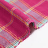 Woven cotton dyed gold lurex check pink background