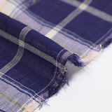 Tejido de algodón teñido de cuadros lurex dorados fondo azul marino