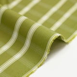 Dyed woven polycotton contrasting ecru white line olive green background