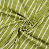 Dyed woven polycotton contrasting ecru white line olive green background