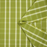 Dyed woven polycotton contrasting ecru white line olive green background