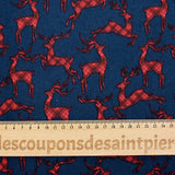 Cotton flannel printed with red deer on navy blue background
