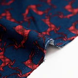Cotton flannel printed with red deer on navy blue background