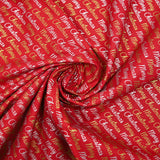 Cotton poplin printed with Merry Christmas in gold and silver on a red background