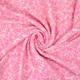 Double gauze printed with pink flowers on an ecru background