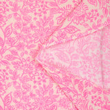 Double gauze printed with pink flowers on an ecru background