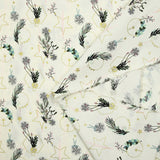 Cotton poplin printed with winter branches, golden balls and stars on an ecru background