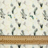 Cotton poplin printed with winter branches, golden balls and stars on an ecru background