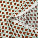 Viscose satin with brown and mint superimposed check print on an ecru background