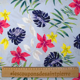 Popeline de coton imprimée fleurs tropicales fond bleu ciel
