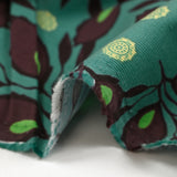 Velours de coton côtelé imprimé feuillage aubergine fond turquoise