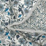 Double-sided quilted cotton Mayla blue flowers white background per meter