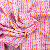 Coton imprimé vague fond rose