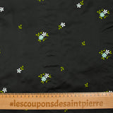 Polyester satin embroidered water green flowers on black background