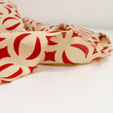 Red parenthesis printed cotton Beige background