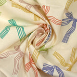Cotton printed ribbon bows with ecru background