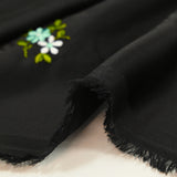 Polyester satin embroidered water green flowers on black background