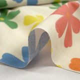 Algodón estampado con flores de Ninon sobre fondo crudo