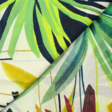 Green jungle print cotton voile with off-white background