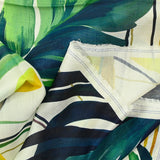 Green jungle print cotton voile with off-white background