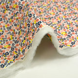 Double-sided quilted cotton Mayla salmon flowers white background per meter