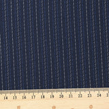 Tissu tailleur 100% laine rayé bleu et blanc fond marine