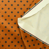 Velours ras imprimé pois fond orange brûlé