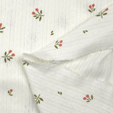 Punto pointelle de algodón con estampado de tulipanes, fondo blanquecino