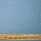 Cotton chambray decorated with rhinestones on a sky blue background