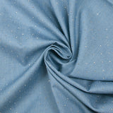 Cotton chambray decorated with rhinestones on a sky blue background