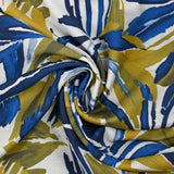 Crepe de viscosa estampado selva anís y fondo blanco azul