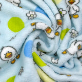Edredón polar estampado con flores y patitos sobre fondo azul cielo