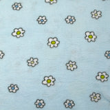 Edredón polar estampado con flores y patitos sobre fondo azul cielo