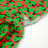 Viscose imprimée découpage vert fond rouge