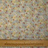 Ribbed chiffon printed with red, blue and yellow flowers on a white background