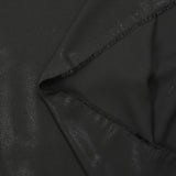 Crêpe de polyester fin pailleté ton sur ton fond noir